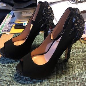 Black peep toe pumps with crystals